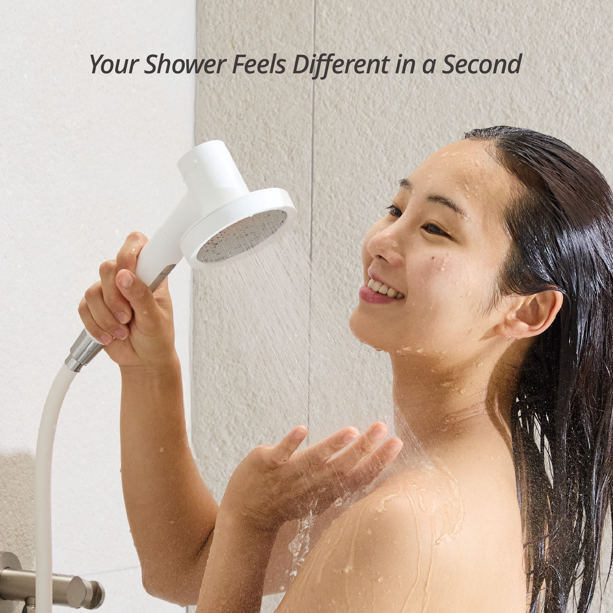 Model demonstrating the immediate skin and hair benefits of the SecondShower handheld filter, highlighting a premium, Korean-inspired experience.